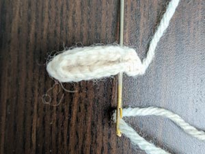 Then sew ends of ears together here.