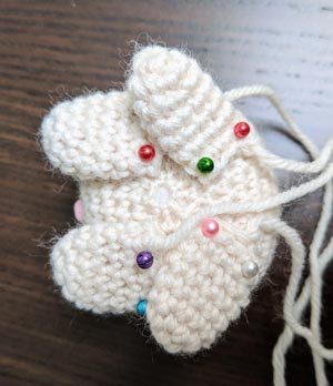 Attach unstuffed legs to the bottom of the kitty body.